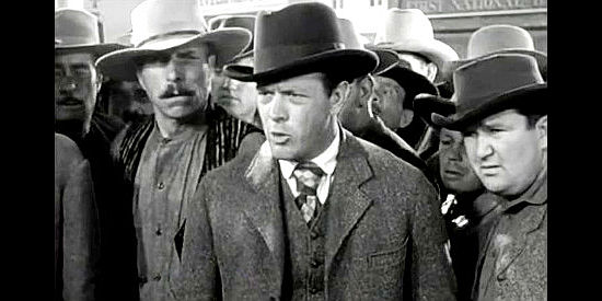 Harvey Stephens as Rigby, the man whose fraudulant surveys pits the Daltons against the law in When the Daltons Rode (1940)