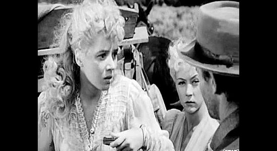 Jeff Donnell as Elaine Wyatt, concerned about where Clay Phillips is taking the saloon girls in Roughshod (1949)