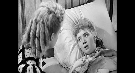 Jefff Donnell as Elaine Wyatt, fearful her friends will tell her parents too much about her saloon girl days in Roughshod (1949)