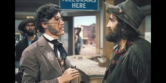 John Carradine as Doc Murdock checking the fitness of Charlie (Victor Kilian) to work for the telegraph line in Western Union (1941)