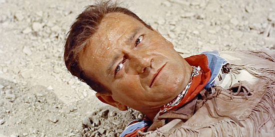 John Wayne as Hondo Lane, in the Apache's hands in Hondo (1953)