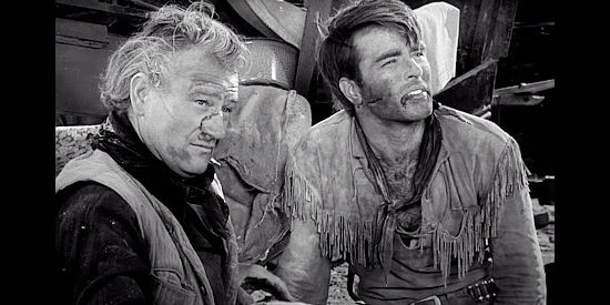 John Wayne as Tom Dunson and Montgomery Clift as Matt Garth, settling their differences with fists in Red River (1948)