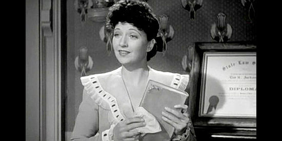 Kay Francis as Julie King, the woman who comes between Tod Jackson and Bob Dalton in When the Daltons Rode (1940)