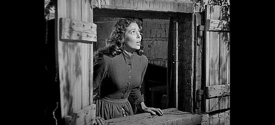 Loretta Young as Rachel Harvey, spotting trouble in her first day at the Harvey home in Rachel and the Stranger (1948)