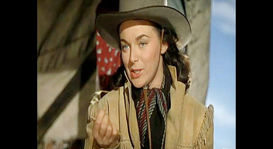 Marguerite Chapman as Luella Purdy, meeting Nick Buckley and finding straw in his vest in Relentless (1948)