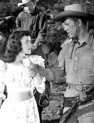 Marguerite Chapman as Luella Purdy with Willard Parker as Sheriff Jeff Moyer in Relentless (1948)