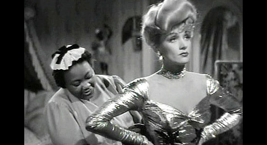 Marietta Canty as Idabelle, helping Cherry Malotte (Marlene Dietrich) prepare to welcome Roy Glennister home in The Spoilers (1942)