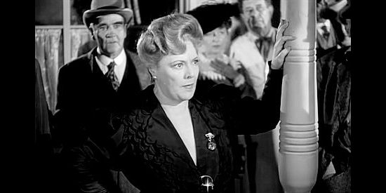 Marjorie Rambeau as Bessie Baxter, the older woman who takes Catherine under her wings in War of the Wildcats (1943)