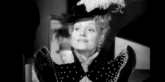 Martha Scott as Catherine Allen, the author who dreams of living the type of life she writes about in War of the Wildcats (1943)