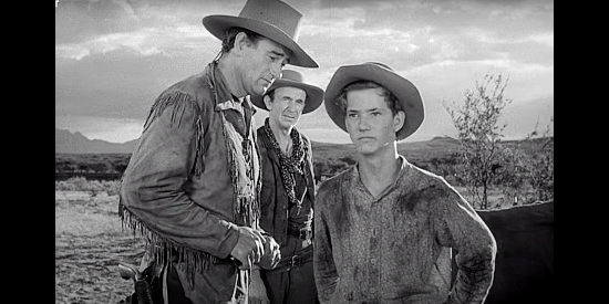 Mickey Kuhn as young Matt, the lone survivor of the Indian attack, meeting Tom Dunson (John Wayne) in Red River (1948)