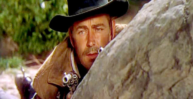 Alan Ladd as Whispering Smith, trying to figure out who tried to ambush him in Whispering Smith (1948)