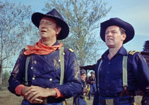 John Wayne as Col. John Marlowe and William Holden as Maj. Henry Kendall, watching Southern troops advance in The Horse Soldiers (1959)