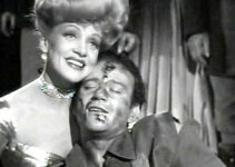 Marlene Dietrich as Cherry Malotte and John Wayne as Roy Glennister, embracing after a wicked fight in The Spoilers (1942)