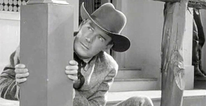 Randolph Scott as Tod Jackson, dodging bullets as a result of a practical joke in When the Daltons Rode (1940)