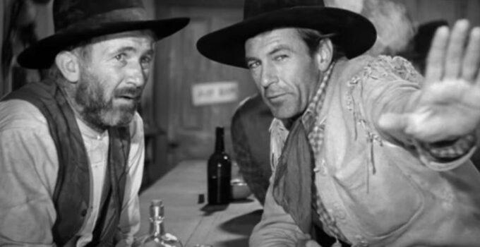 Walter Brennan as Judge Roy Bean listening to a description of Lilly Langtry from Cole Harden (Gary Cooper) in The Westerner (1940)