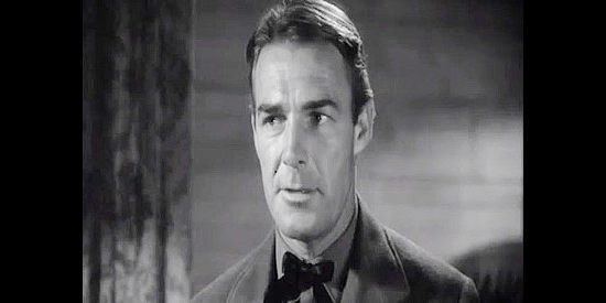 Randolph Scott as Vance Irby, the Confederate officer leading efforts to get badly needed gold to the South in Virginia City (1940)