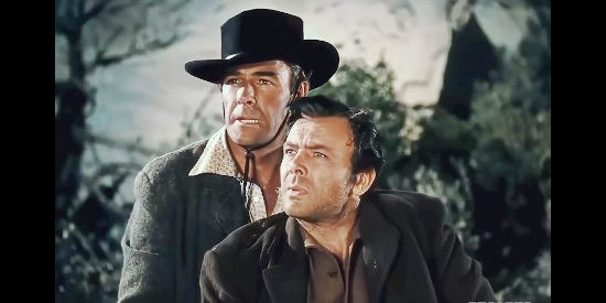 Randolph Scott as Vance Shaw helping a stranger (Dean Jagger as Edward Creighton) survive his wounds in Western Union (1941)