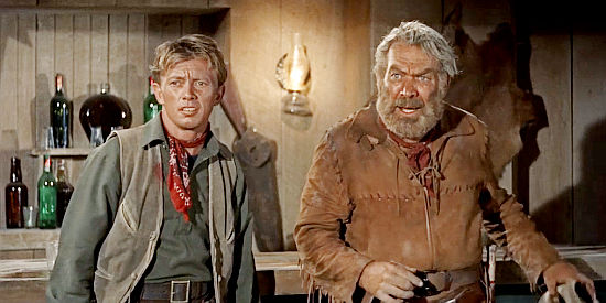 Rayford Barnes as Pete and Ward Bond as Buffalo Baker watching a fistfight in Hondo (1953)