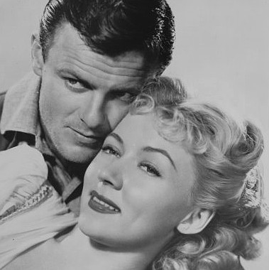 Robert Sterling as Clay Phillips with Gloria Grahame as Mary Wells in Roughshod (1949)