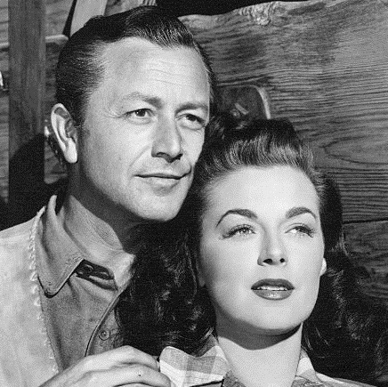 Robert Young as Nick Buckley and Marguerite Chapman as Luella Purdy in Relentless (1948)