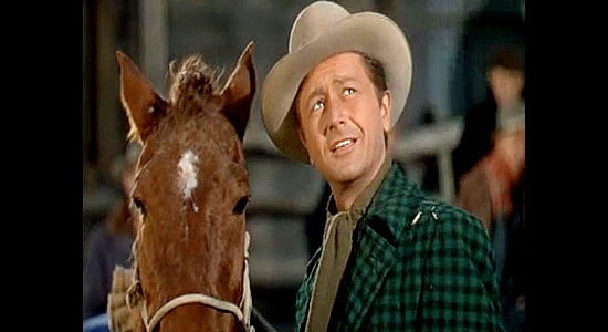 Robert Young as Nick Buckley with his prized mare, getting help from Luella Purdy for the first time in Relentless (1948)