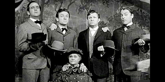 The Dalton boys, Bob (Broderick Crawford), Emmett (Frank Albertson), Ben (Stuart Ervin) and Grat (Brian Donlevy) pose with their Ma (Mary Gordon) in When the Daltons Rode (1940)