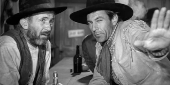 Walter Brennan as Judge Roy Bean listening to a description of Lilly Langtry from Cole Harden (Gary Cooper) in The Westerner (1940)