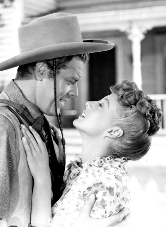 Willard Parker as Dr. Sam Martin with Evelyn Keyes as Hannah Brockway in Renegades (1946)