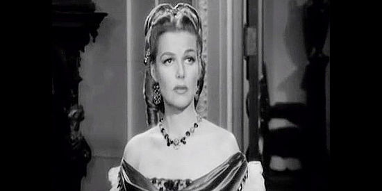 Ann Sheridan as Georgia Moore, eventually succumbing to Mike McComb's advances in Silver River (1948)