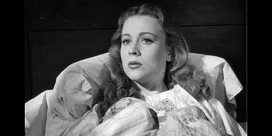 Anne Jeffreys as Cheyenne, recuperating from a wound under Vance Cordell's care in Return of the Bad Men (1948)