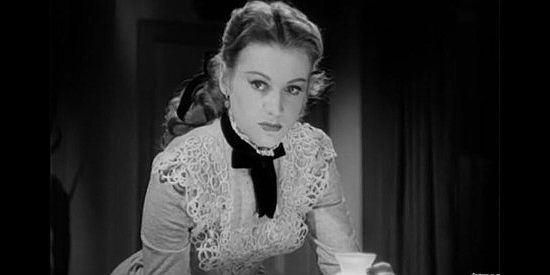 Anne Jeffries as Jeanie McBride, aka Cheyenne, surprised by visitors in the night in Return of the Bad Men (1948)