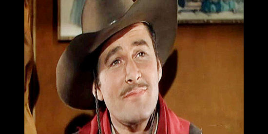 Errol Flynn as Clay Hardin, imagining the bright future he could enjoy with the right woman by his side in San Antonio (1945)