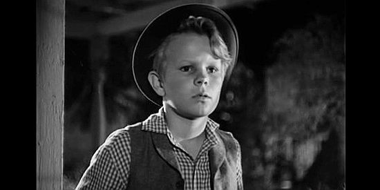 Gary Gray as Johnny, Madge Allen's son, spotting potential trouble in Return of the Bad Men (1948)