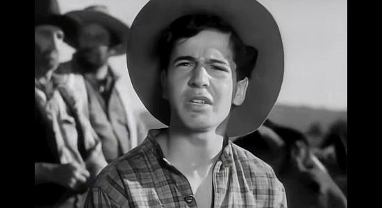 Gene Reynolds as Jason Brown, questioning his father's descent into lawlessness in Santa Fe Trail (1940)