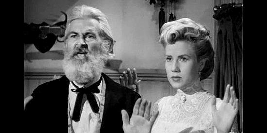 George 'Gabby' Hayes as John J. Pettit and Jacqueline White as daughter Madge Allen, surprised by outlaws in Return of the Bad Men (1948)