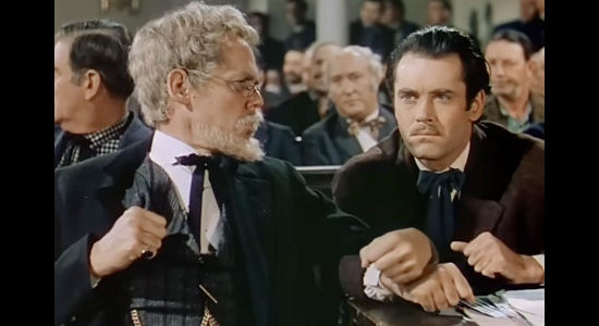 Henry Hull as Maj. Rufus Cobb holding Frank James (Henry Fonda) in check in the courtroom in The Return of Frank James (1940)