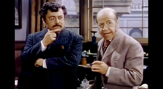 J. Edward Brombert as George Runyan and Donald Meek as McCoy, the railroad men behind the chicanery in The Return of Frank James (1940)