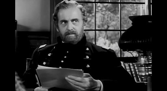 Moroni Olsen as Robert E. Lee, considering the appropriate punishment for rambuctious cadets in Santa Fe Trail (1940)
