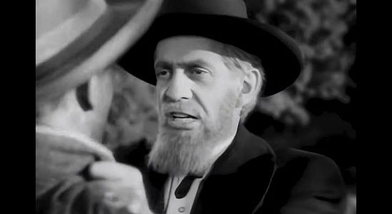 Raymond Massey as John Brown, trying to get his message across in Santa Fe Trail (1940)