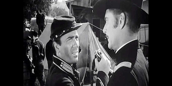 Tom D'Andrea as Pistol Porter, getting a bugle call order from Mike McComb (Errol Flynn) in Silver River (1948)