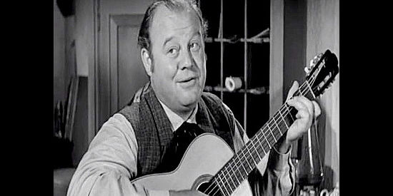 Burl Ives as the singing hotel clerk, warning Haven of the trouble he's likely to face in Station West (1948)