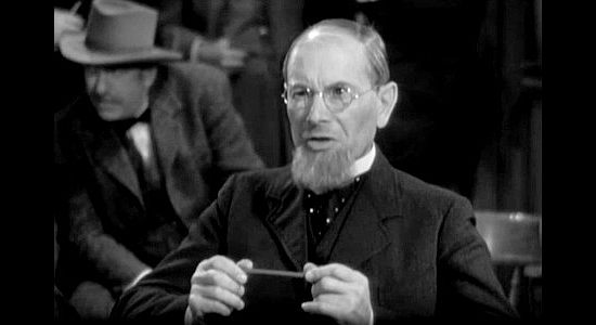 Charles Halton as Henry Adams, the banker who begrudgingly agrees to extend the mining company's loan in 20 Mule Team (1940)