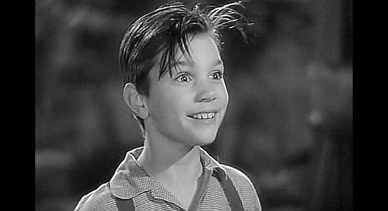 Darryl Hickman as Tommy Gargan, the young boy who winds up riding the mail wagon with Baggot in Jackass Mail (1942)