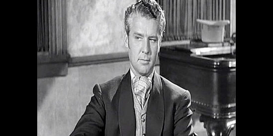 Gordon Oliver as Prince, one of the men watching over Charlie in Station West (1948)