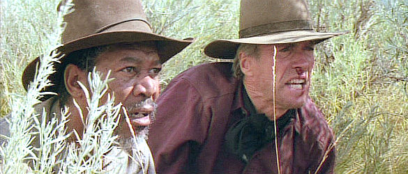 Morgan Freeman as Ned Logan and Clint Eastwood as Bill Munny, trying to find the Schofield Kid in Unforgiven (1992)