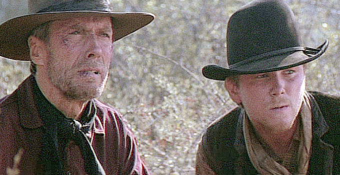 Clint Eastwood as Bill Munny and Jaimz Woolvett as The Schofield Kid in Unforgiven (1992)