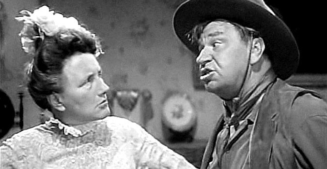 Marjorie Main as Clementine 'Tiny' Tucker and Wallace Beery as Marmaduke Baggot, bickering partners in the Jackass Mail (1942)
