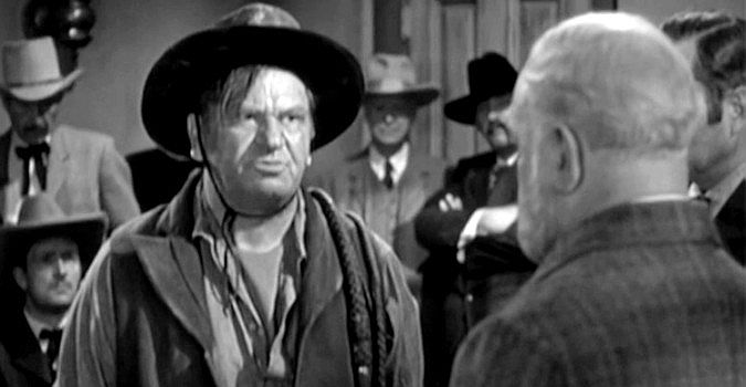 Wallace Beery as Bill Bragg, demanding back pay from Jackass Brown in 20 Mule Team (1940)