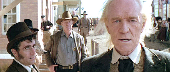 Richard Harris as English Bob, confronted by Little Bill as his biographer looks on in Unforgiven (1992)