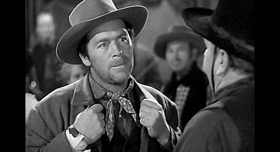 William Haade as Red Gargan, Tommy's dad, about to get into a barroom shootout with Baggot in Jackass Mail (1942)